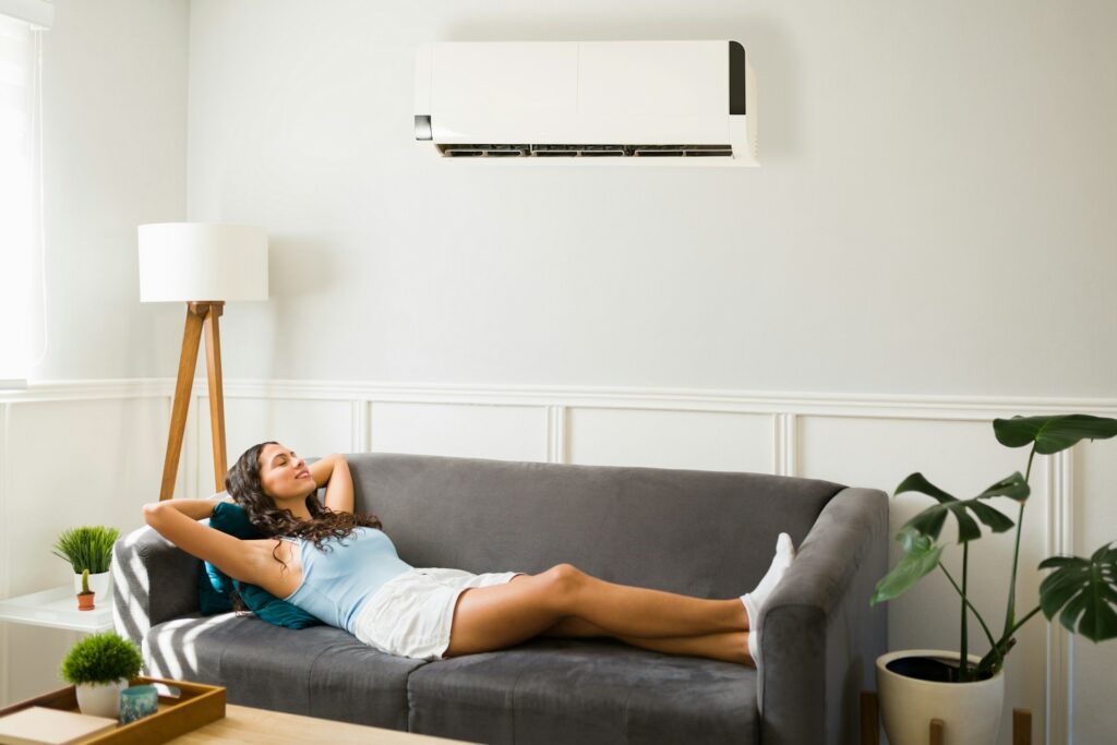 woman using air conditioning split system