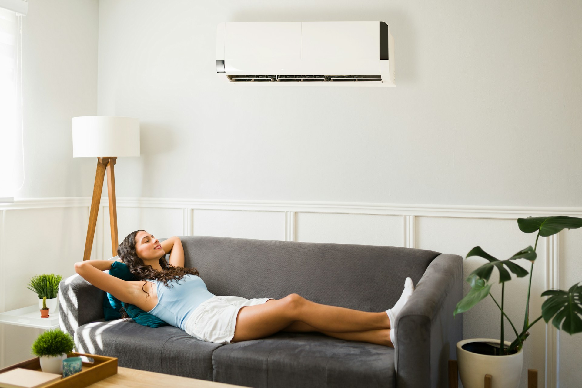 woman using air conditioning split system